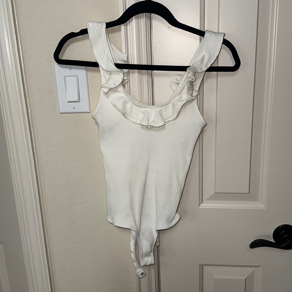 White ribbed body suit - thick material, not see-through with a nude bra